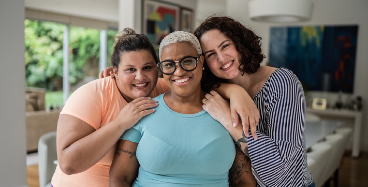 Three friends smiling